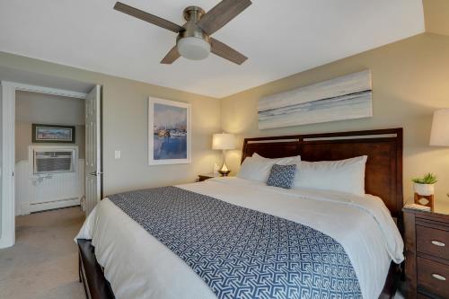a bedroom with a bed and a ceiling fan at 311 Water Street Inn in Boyne City