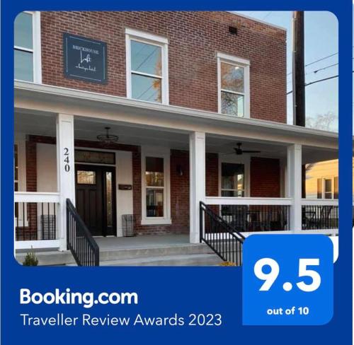 a review of the travel review awards in front of a brick building at Brickhouse Loft - a boutique hotel in Martinsville