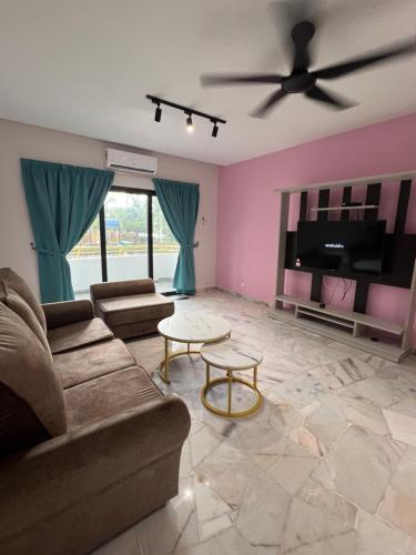 a living room with a couch and a ceiling fan at BayView Villas Condo - Premium Unit in Port Dickson
