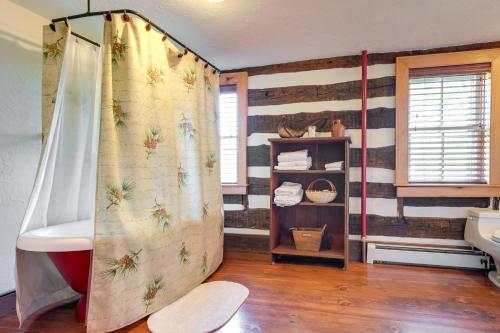 a bathroom with a shower curtain in a room at Rustic Wellsville Home - 5 Mi to Roundtop Mountain 