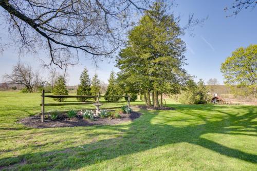 a park with a bench and trees in a field at Rustic Wellsville Home - 5 Mi to Roundtop Mountain in Wellsville