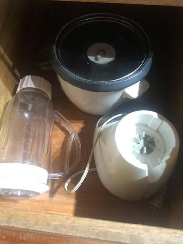 a shelf with a blender and other items on it at 'Crows Nest' Studio Apt. in Big Corn Island