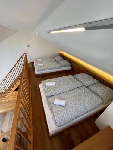 two bunk beds in a room with a staircase at Palava eu 7 in Pavlov