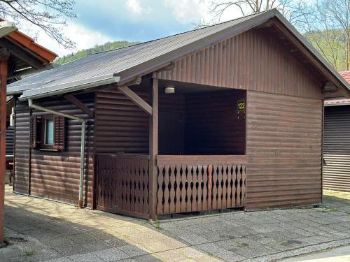 a large wooden building with a large door at G122 SREČNA HIŠKA Aqualuna & Terme Olimia Vstopnice in Podčetrtek