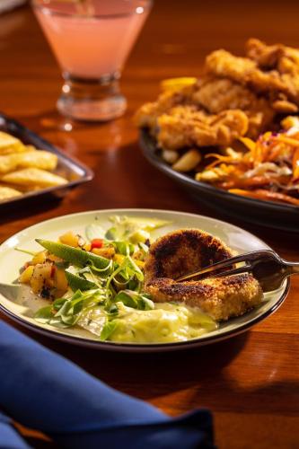 a plate of food on a table with plates of food at Portland Regency Hotel & Spa in Portland