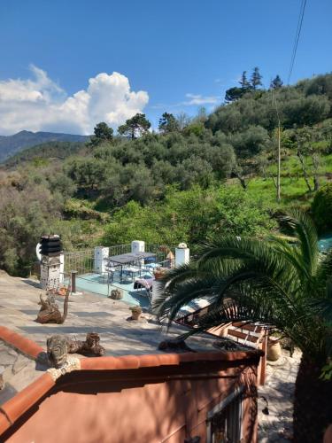 a view from the balcony of a house with a pool at B&B Maremesco in Levanto