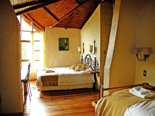 Postel nebo postele na pokoji v ubytování Hacienda Tres Lagos