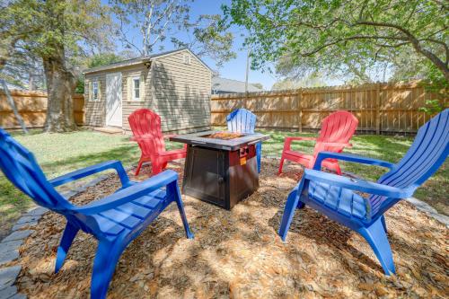 a group of chairs and a grill in a yard at Lovely Morehead City Home with Fire Pit and Gas Grill in Morehead City