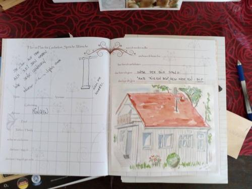an open book with a drawing of a house at Wohnung am Fuße des Schwarzwalds in Oberkirch