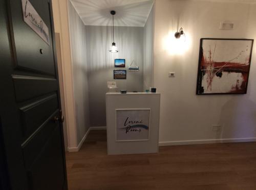 a room with a table with writing on it at Loremi Rooms in Termoli