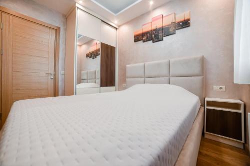 Postel nebo postele na pokoji v ubytování Apartman E.M.A