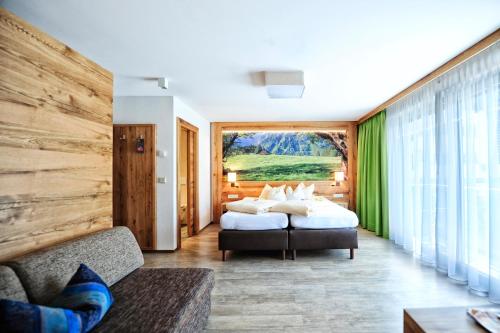 Postel nebo postele na pokoji v ubytování Hotel Arnika