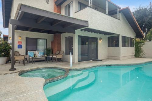 a house with a swimming pool in front of a house at Peaceful Private Retreat In The Heart Of Town in Redlands