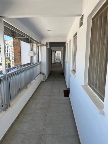 an empty hallway of a building with a hallway at Hany apartment Ducado 7-C in Benidorm