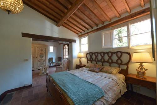 a bedroom with a large bed in a room at Villa Lucchesi in Bagni di Lucca