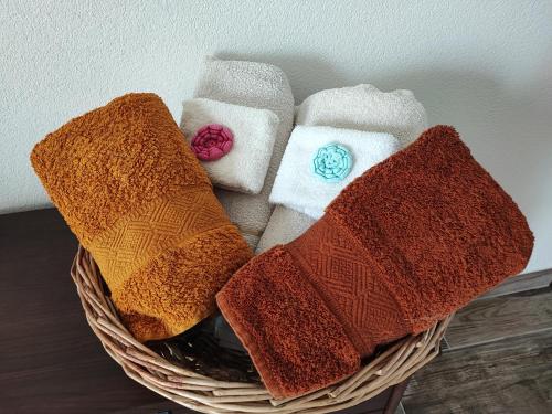 a basket filled with towels sitting on a table at Casale del Valla Agri B&B Naturista in Spigno Monferrato