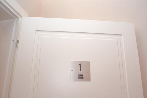a lightswitch on a white door in a room at SCIPIO92HOME in Rome