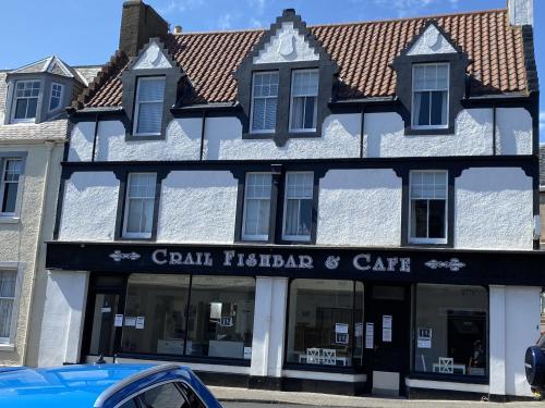 a building with a car parked in front of it at The Crail Maltings in Crail