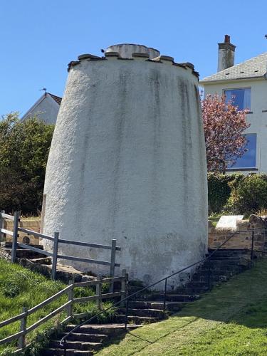a large tower with stairs in front of a house at The Crail Maltings in Crail