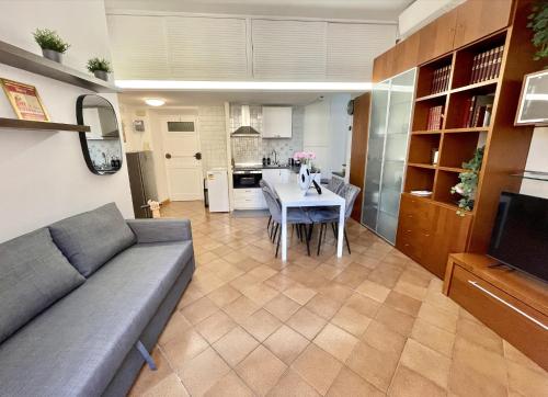 a living room with a couch and a table at ETERNA Trastevere Apartment in Rome