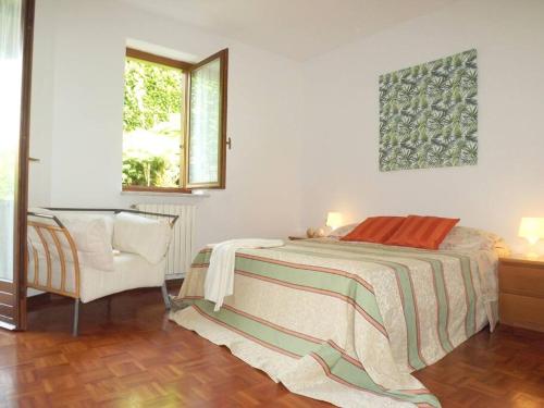 Tempat tidur dalam kamar di Your family home in Luino