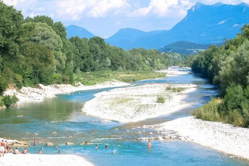 a group of people swimming in a river at studio-ville médievale-charmant in Crest