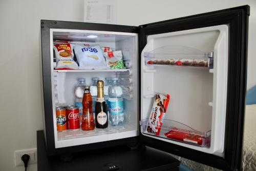 an open refrigerator filled with drinks and drinks at B&B DEGLI ANGELI in Lecce