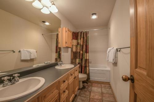 a bathroom with a sink and a toilet at Tenderfoot Lodge 2620 in Keystone