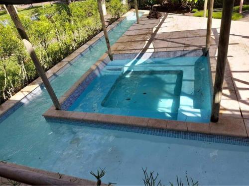 a swimming pool in the middle of a yard at Casa, Cabo Tortugas, Monterrico in Monterrico