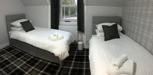 Postel nebo postele na pokoji v ubytování Glenshee Guest House