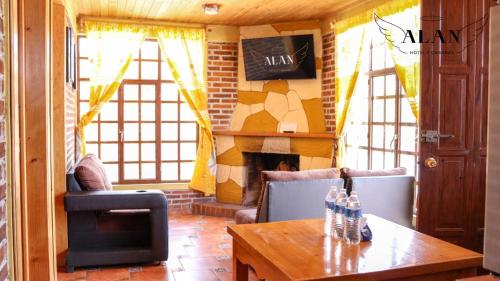 Un lugar para sentarse en Hotel y Cabañas Alan
