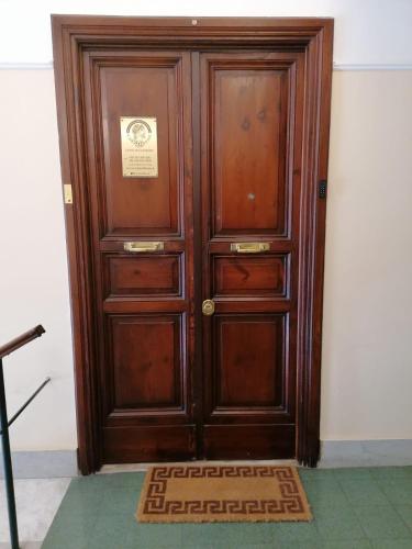 a wooden door with a sign on it at SCIPIO92HOME in Rome