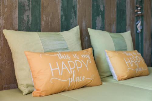 a couple of pillows sitting on top of a bed at HC Torreira Beach in Torreira