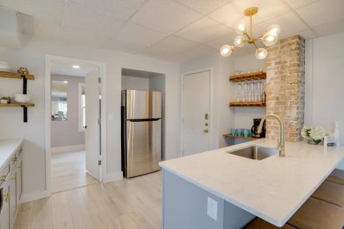 a kitchen with a sink and a refrigerator at Spacious South Haven Retreat Near Lake Michigan in South Haven
