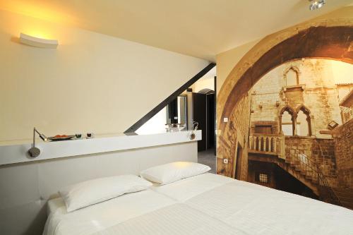 Posteľ alebo postele v izbe v ubytovaní La Porta Luxury Rooms
