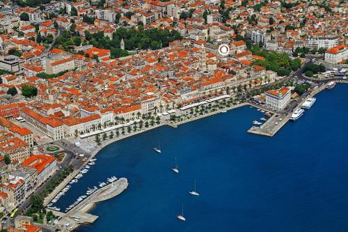 an aerial view of a city with boats in the water at La Porta Luxury Rooms in Split