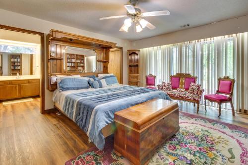 a bedroom with a bed and a ceiling fan at Gassville Home 3 Mi to White River and Trout Fishing in Gassville