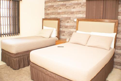 Ένα ή περισσότερα κρεβάτια σε δωμάτιο στο The Vista Inn
