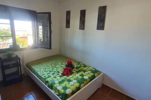 a small child sitting on a bed in a room at LANZATE! in Tinajo