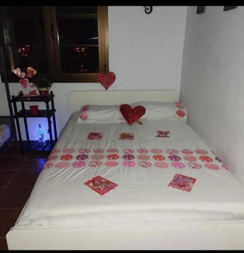 a bed with two hearts on top of it at LANZATE! in Tinajo