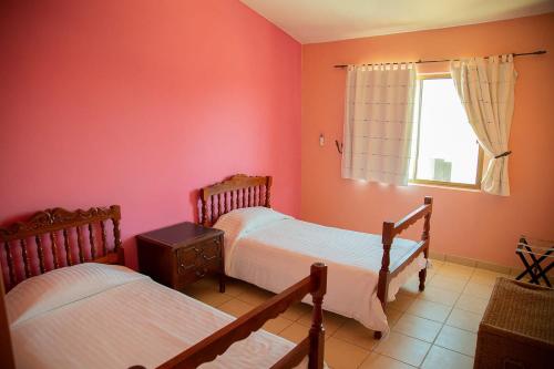 Ein Bett oder Betten in einem Zimmer der Unterkunft Garimar Condominios en San Carlos