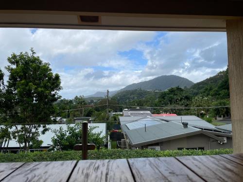 a view from a window of a house with mountains at Nolan garden house in whitfield in Stratford