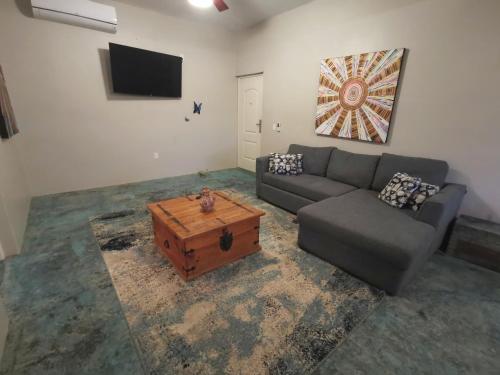 a living room with a couch and a coffee table at Mystic Breeze in El Pescadero