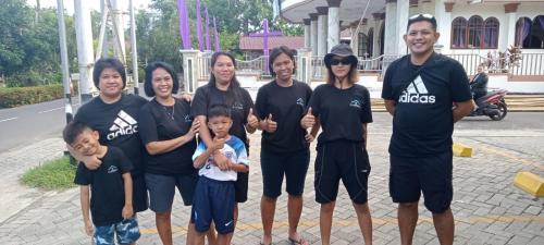a group of people posing for a picture at EL Homestay Bunaken in Bunaken