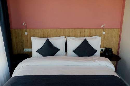 Un ou plusieurs lits dans un hébergement de l'établissement Graf Hotel