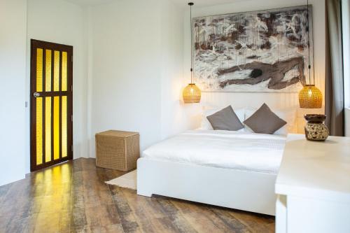Ένα ή περισσότερα κρεβάτια σε δωμάτιο στο MAïLO pool villa 5BR 10 guests