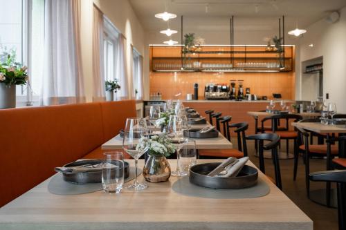 a long row of tables in a restaurant at Kloster by b-smart in Schaan