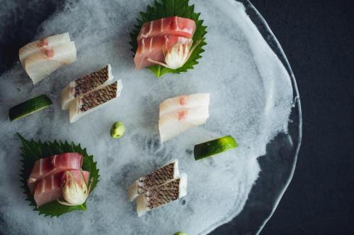 a plate of sushi with ham and vegetables on it at TheMana Village in Tosashimizu
