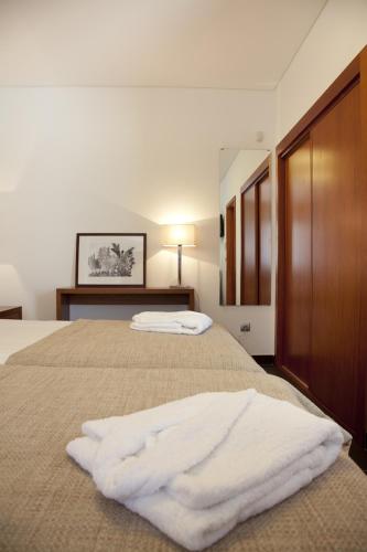 Llit o llits en una habitació de Jeiroes Do Mar