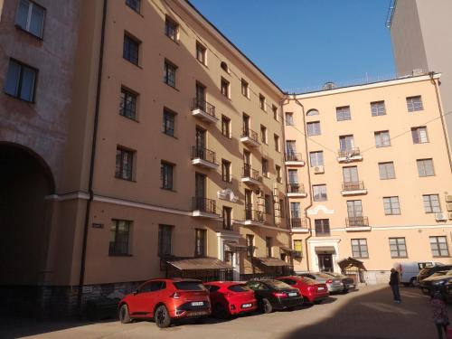 a row of cars parked in front of a building at Gonsiori 3 Tenors Apartment in Tallinn